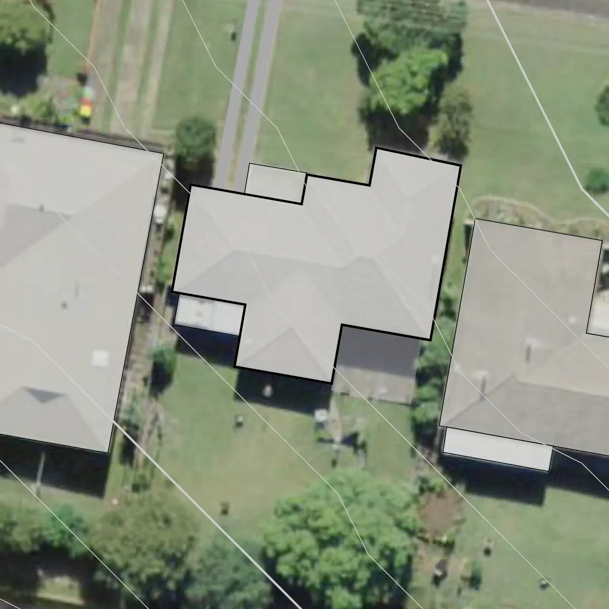 Additional structures and paved areas traced.